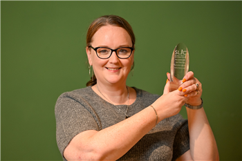 Team Manager Libraries and Customer Services Caroline Messer with the SLIC award