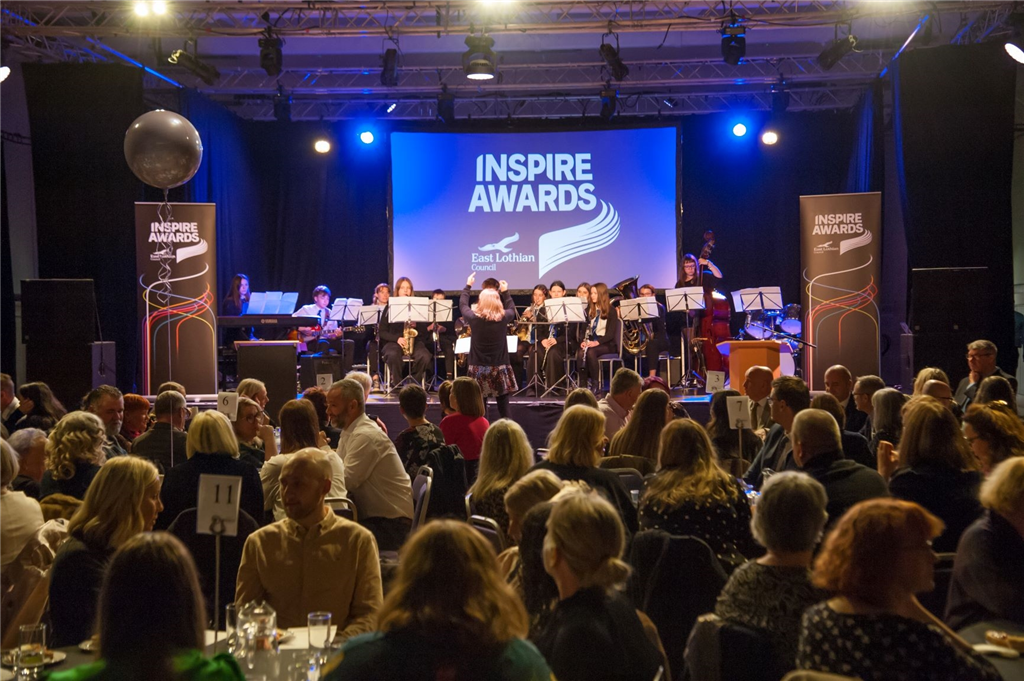 Inspire Awards room & stage with band